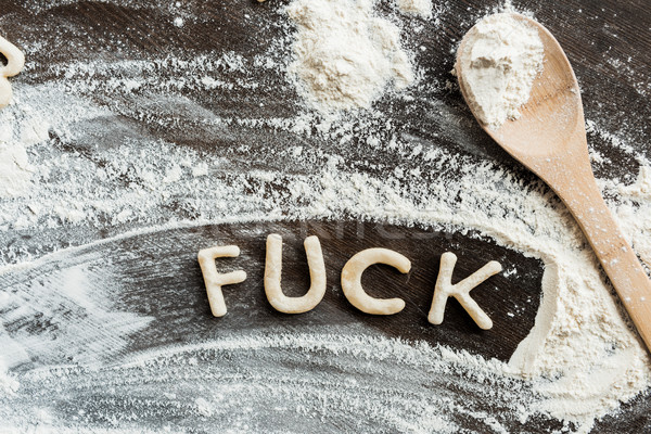 Top view of edible word fuck made from sweet crunchy cookies, baking cookies concept Stock photo © LightFieldStudios