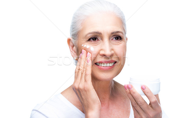 Senior donna crema bella crema per il viso Foto d'archivio © LightFieldStudios