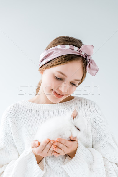 beautiful smiling girl holding furry white rabbit isolated on white Stock photo © LightFieldStudios