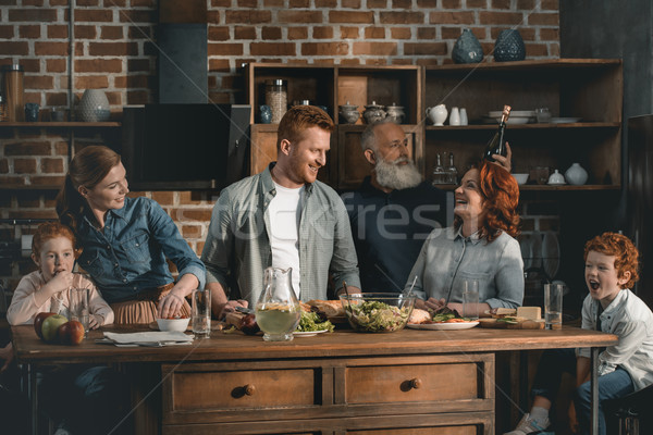 Stock photo: family cooking dinner together