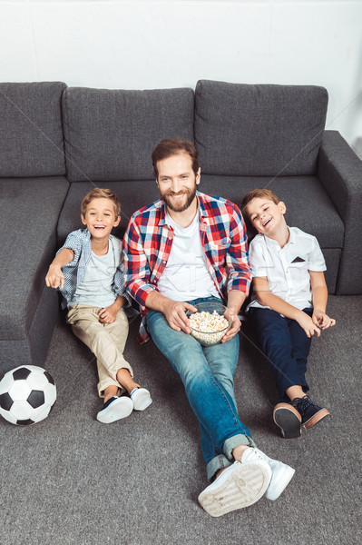 family watching soccer match at home Stock photo © LightFieldStudios