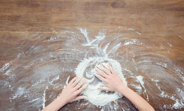 top view of child making pizza dough on wooden tabletop Stock photo © LightFieldStudios
