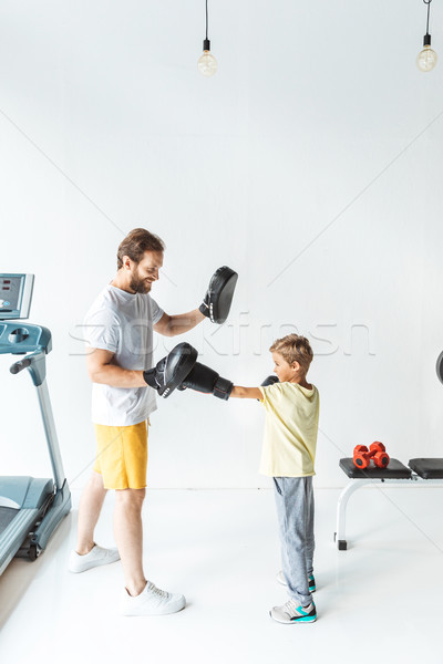 Père en fils boxe ensemble vue de côté gymnase famille [[stock_photo]] © LightFieldStudios