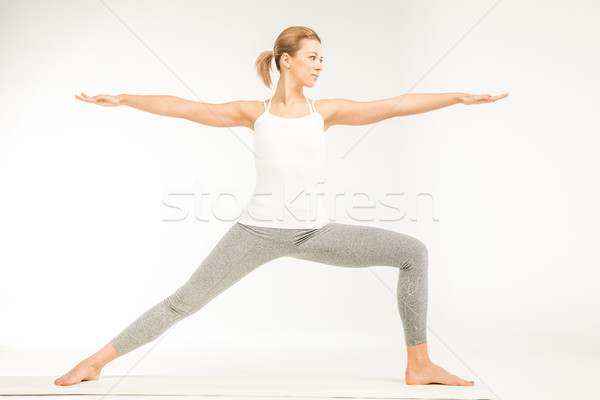 Nő áll jóga pozició gyakorol variáció Stock fotó © LightFieldStudios