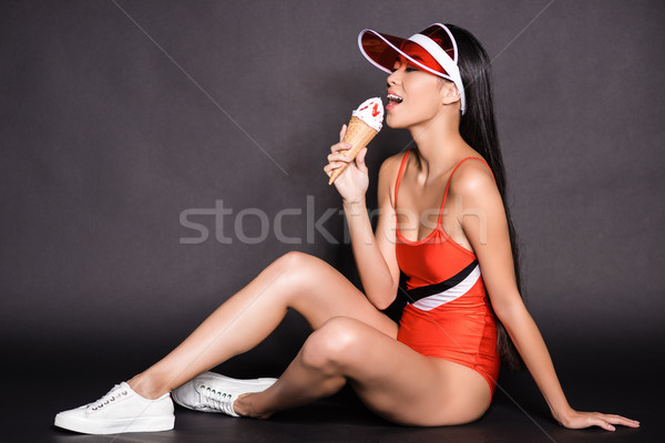 Kobieta strój kąpielowy jedzenie lody shot piękna Zdjęcia stock © LightFieldStudios