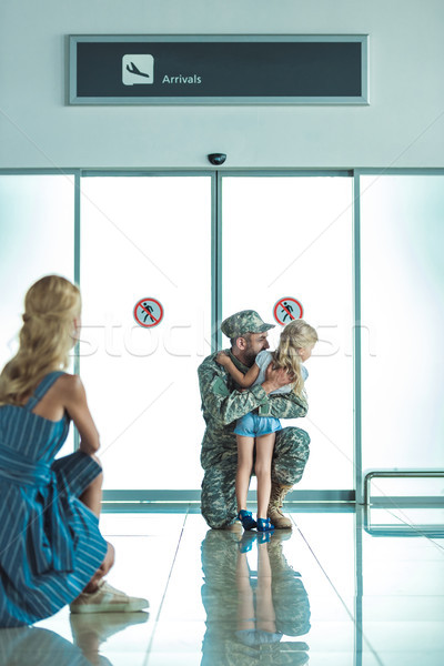 child hugging father in military uniform Stock photo © LightFieldStudios
