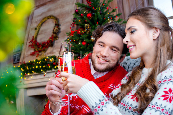 Couple toasting with champagne glasses Stock photo © LightFieldStudios