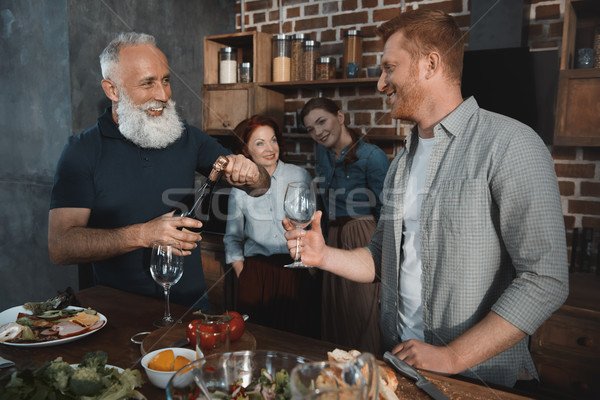 Mężczyzn pitnej wina selektywne focus uśmiechnięty kobiet Zdjęcia stock © LightFieldStudios