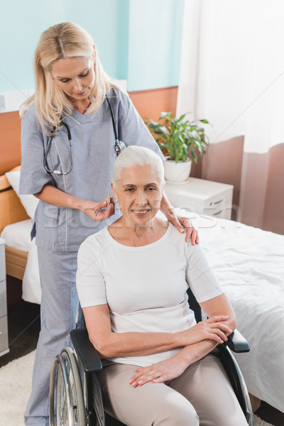 Stock photo: nurse and senior woman in wheelchair