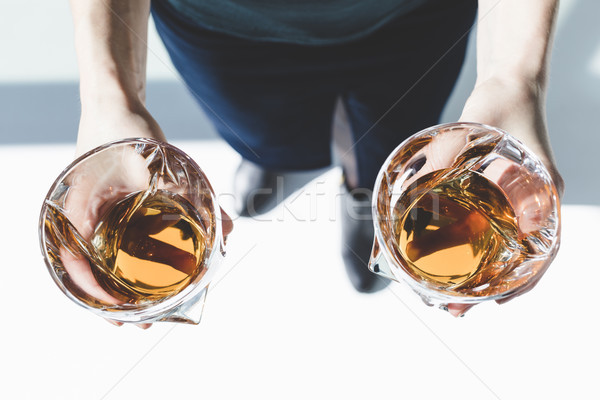 Személy tart szemüveg whiskey lövés hideg Stock fotó © LightFieldStudios