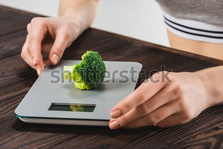 Stock photo: Woman cutting salad greens
