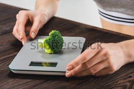 Woman cutting salad greens Stock photo © LightFieldStudios