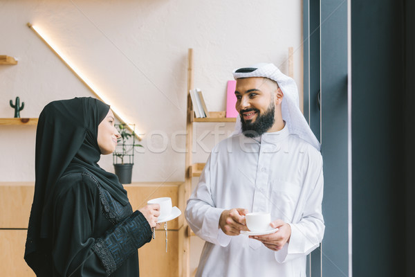 muslim couple drinking coffee Stock photo © LightFieldStudios