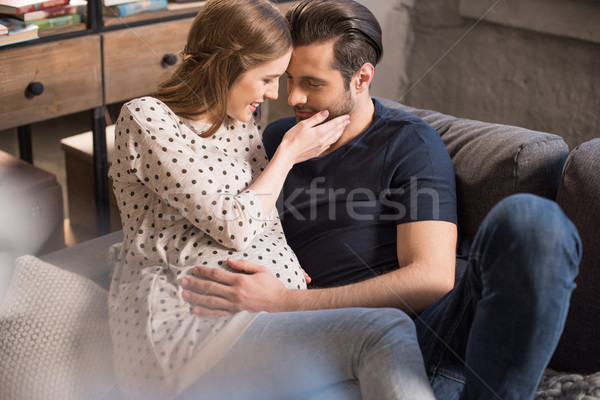 男 妊婦 笑みを浮かべて 座って ソファ 触れる ストックフォト © LightFieldStudios
