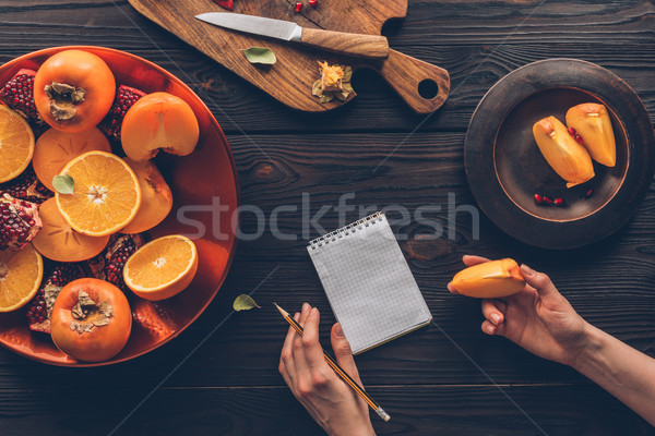 Afbeelding vrouw potlood persimmon stuk Stockfoto © LightFieldStudios