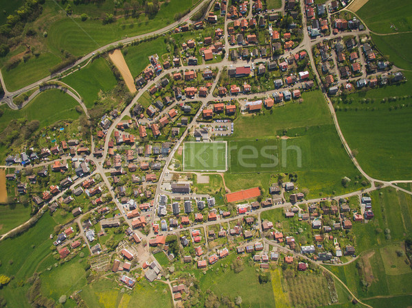 Aerial view of town and green soccer stadium in Germany Stock photo © LightFieldStudios