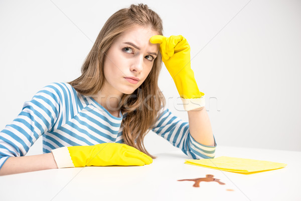 Unhappy woman in rubber gloves Stock photo © LightFieldStudios