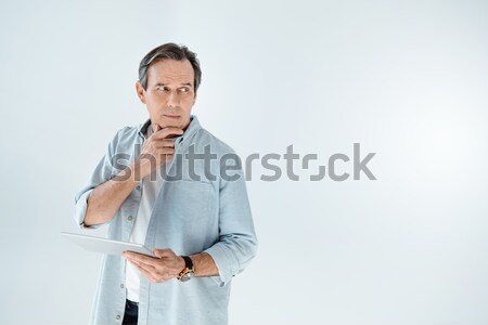 Pensive homme mûr numérique comprimé [[stock_photo]] © LightFieldStudios