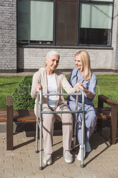 nurse and senior patient with walker Stock photo © LightFieldStudios