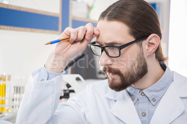 Homme scientifique lunettes jeunes pensive [[stock_photo]] © LightFieldStudios