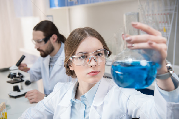 Stock photo: Scientist holding chemical sample