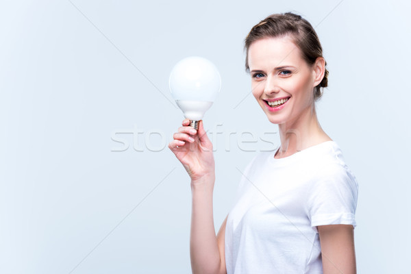 Frau Glühlampe schöne Frau halten isoliert weiß Stock foto © LightFieldStudios
