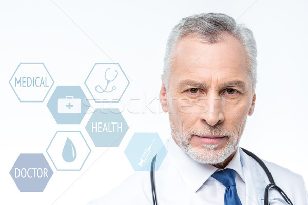 doctor with stethoscope and medical care icons Stock photo © LightFieldStudios