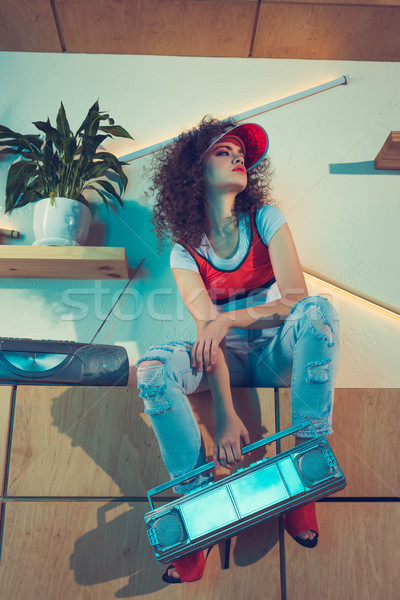 stylish woman holding boombox Stock photo © LightFieldStudios