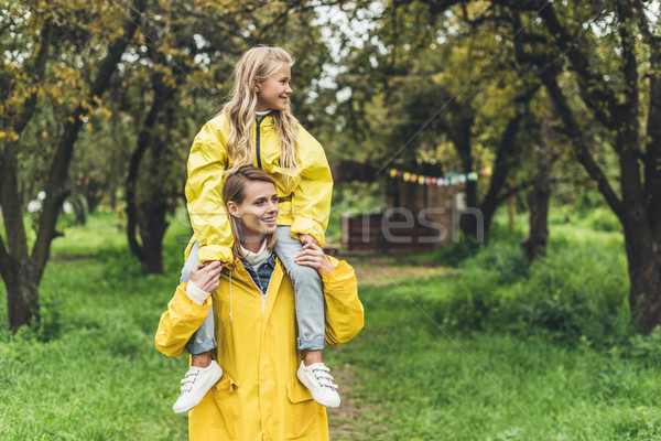 mother piggybacking her daughter Stock photo © LightFieldStudios
