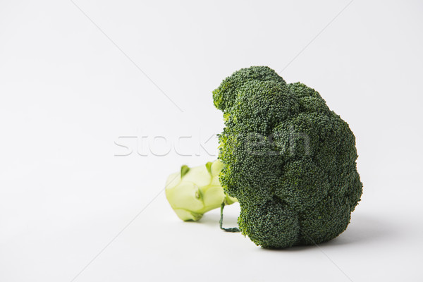 Stock photo: green raw brocolli laying on white background  