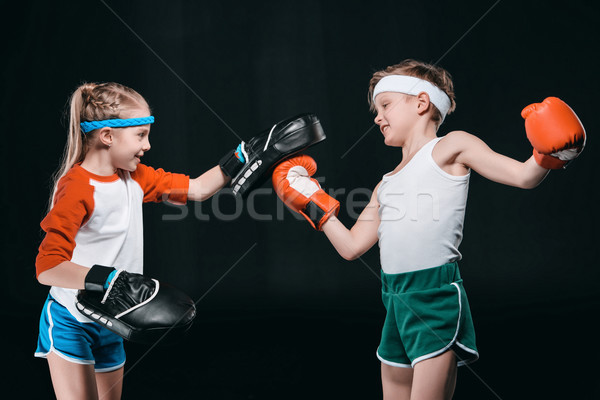 Vue de côté garçon fille boxe isolé [[stock_photo]] © LightFieldStudios