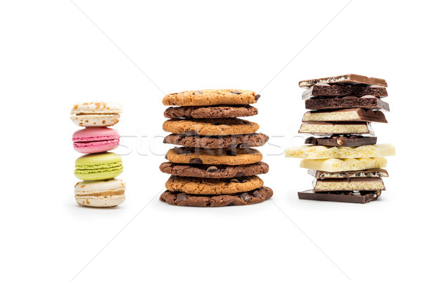 front view of macaroons, cookies and chocolate bars isolated on white Stock photo © LightFieldStudios