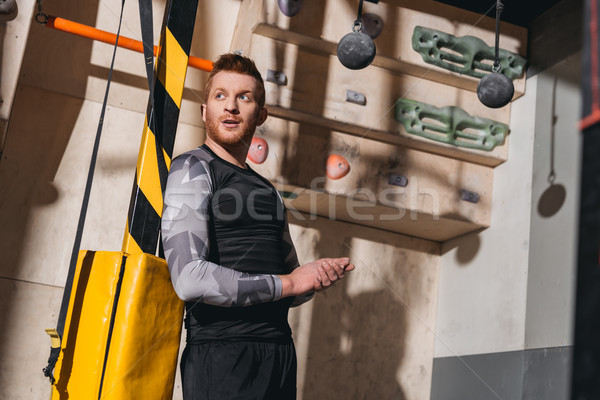 young man in sportive attire at gym Stock photo © LightFieldStudios