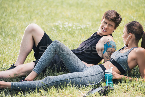 sportive couple resting in park Stock photo © LightFieldStudios