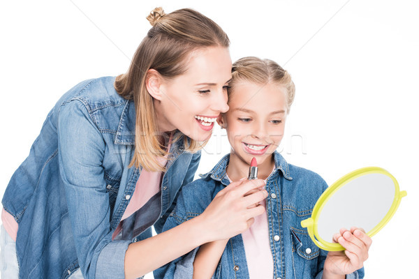 daughter applying makeup Stock photo © LightFieldStudios