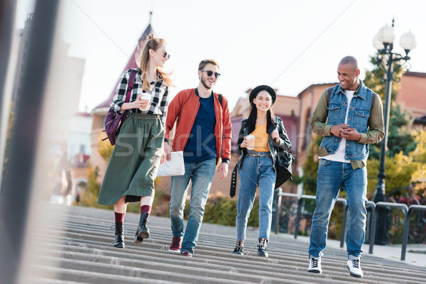 Multicultural amigos caminando calle grupo junto Foto stock © LightFieldStudios