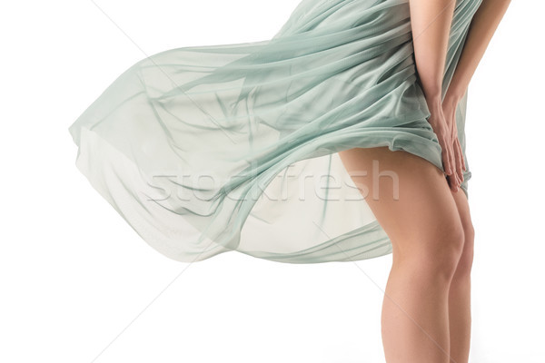 cropped view of sensual girl posing in waving transparent blue dress, isolated on white Stock photo © LightFieldStudios