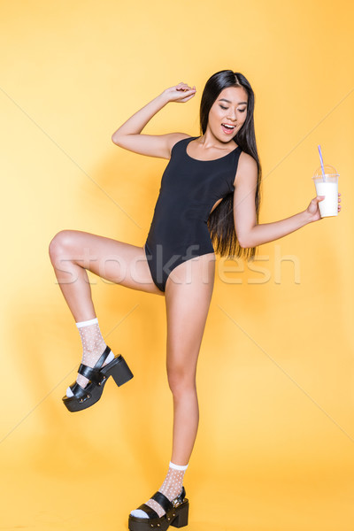 Femme maillot de bain souriant asian noir sandales Photo stock © LightFieldStudios