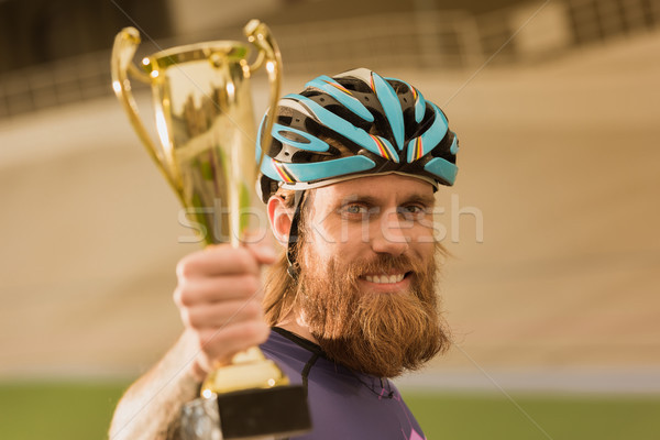 Kerékpáros bajnok csésze szelektív fókusz mosolyog néz Stock fotó © LightFieldStudios