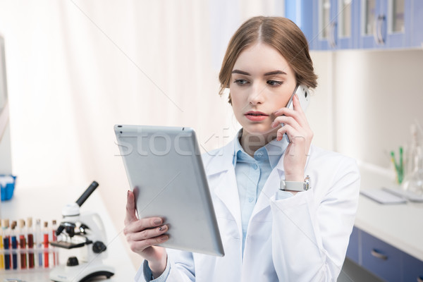 Stock photo: Scientist talking on smartphone