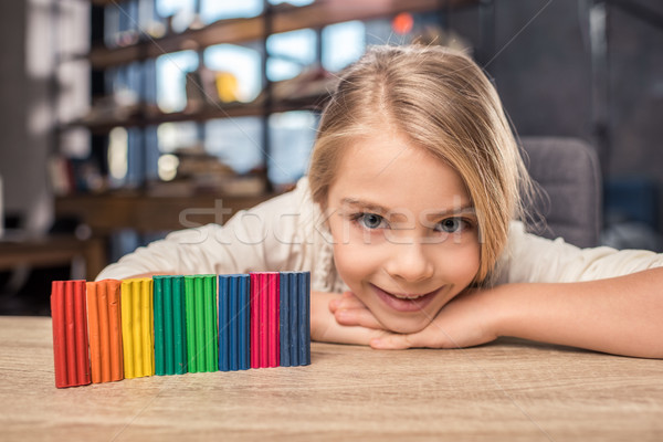 Girl playing with plasticine Stock photo © LightFieldStudios