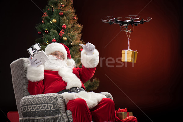 Stock photo: Santa Claus using drone