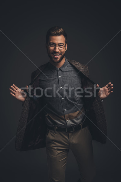 человека подтяжки смеясь молодым человеком костюм Сток-фото © LightFieldStudios