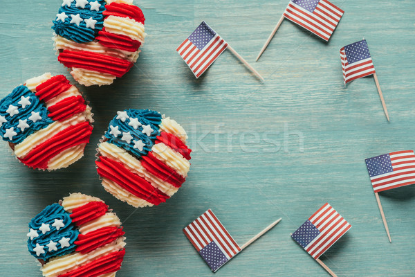 flat lay with arranged cupcakes and american flags on wooden tabletop, presidents day celebration co Stock photo © LightFieldStudios