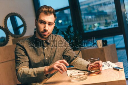 handsome man counting cash Stock photo © LightFieldStudios