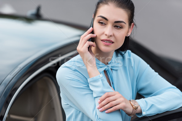 businesswoman talking on smartphone Stock photo © LightFieldStudios