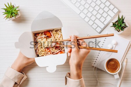 Close-up view of woman grating cheese on pizza on white wooden background Stock photo © LightFieldStudios
