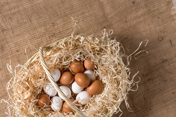 Chicken eggs in basket Stock photo © LightFieldStudios