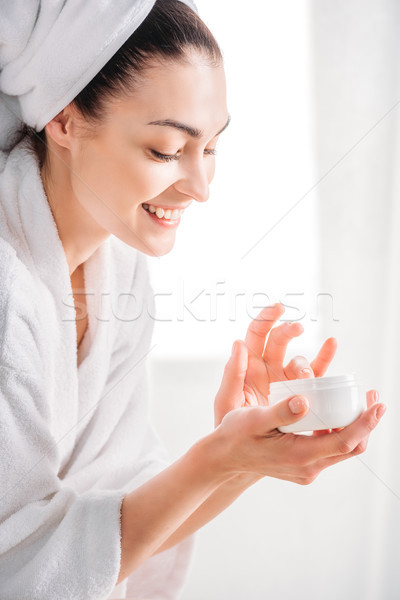 Mulher roupão de banho sorrindo branco Foto stock © LightFieldStudios