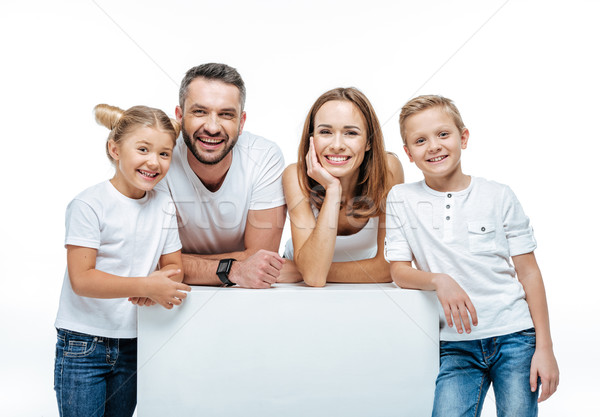 Cheerful family standing together Stock photo © LightFieldStudios